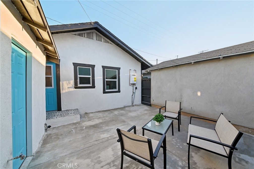 1328 Dawson Avenue Long Beach, CA 90804 - Photo 17 of 22 a backyard of a house with table and chairs
