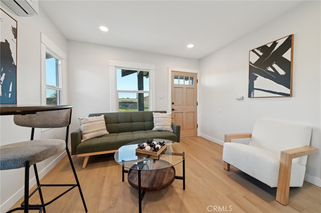 1328 Dawson Avenue Long Beach, CA 90804 - Photo 2 of 22 a living room with furniture and a potted plant