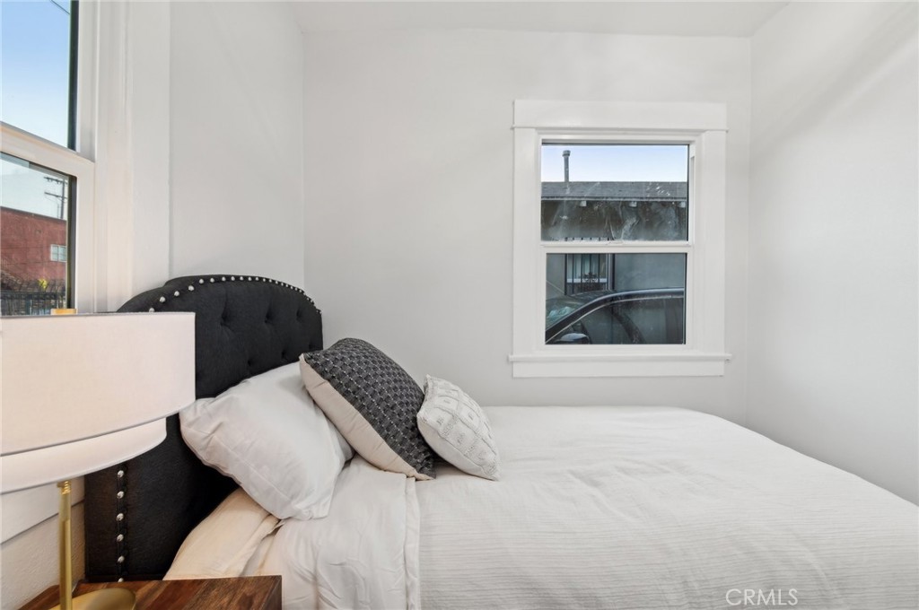 1328 Dawson Avenue Long Beach, CA 90804 - Photo 8 of 22 a bedroom with a bed and cabinets