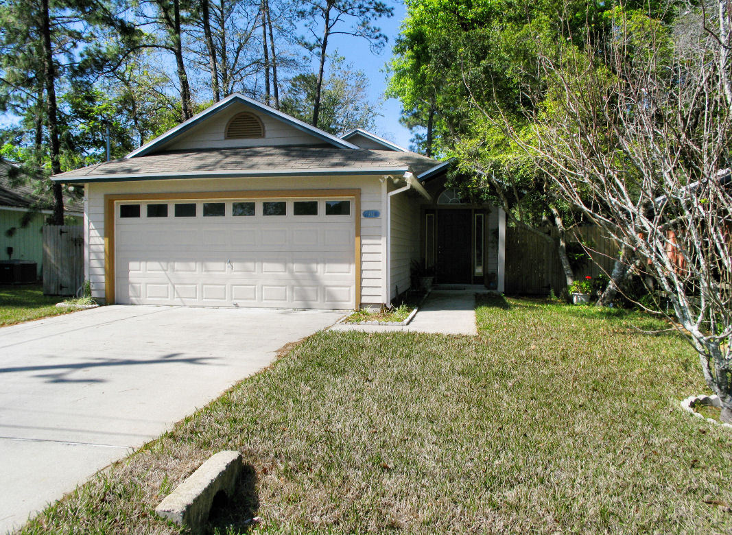 954 Stocks Street Atlantic Beach, FL 32233 - Photo 1 of 21 a front view of a house with a yard and garage