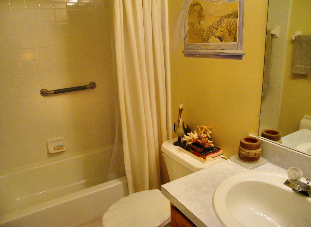 954 Stocks Street Atlantic Beach, FL 32233 - Photo 13 of 21 a bathroom with a sink toilet and shower
