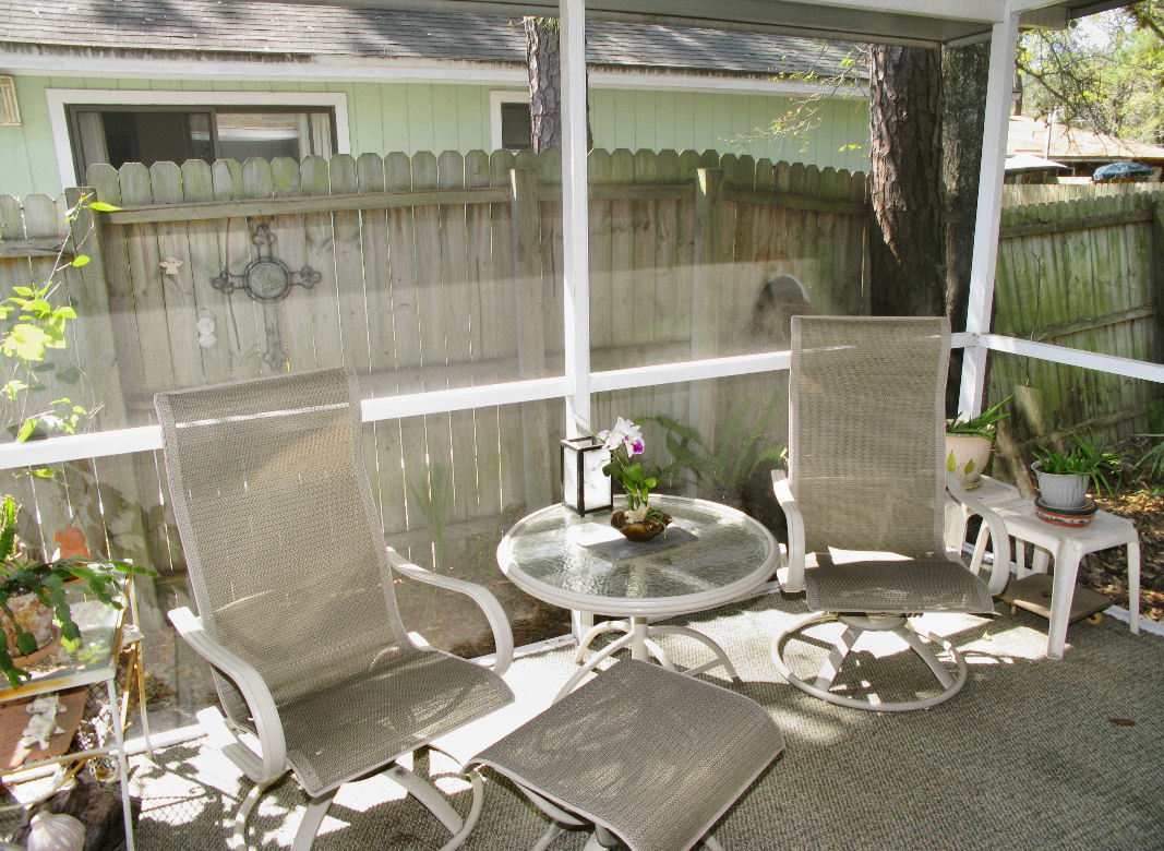 954 Stocks Street Atlantic Beach, FL 32233 - Photo 15 of 21 a dining room with furniture and a floor to ceiling window