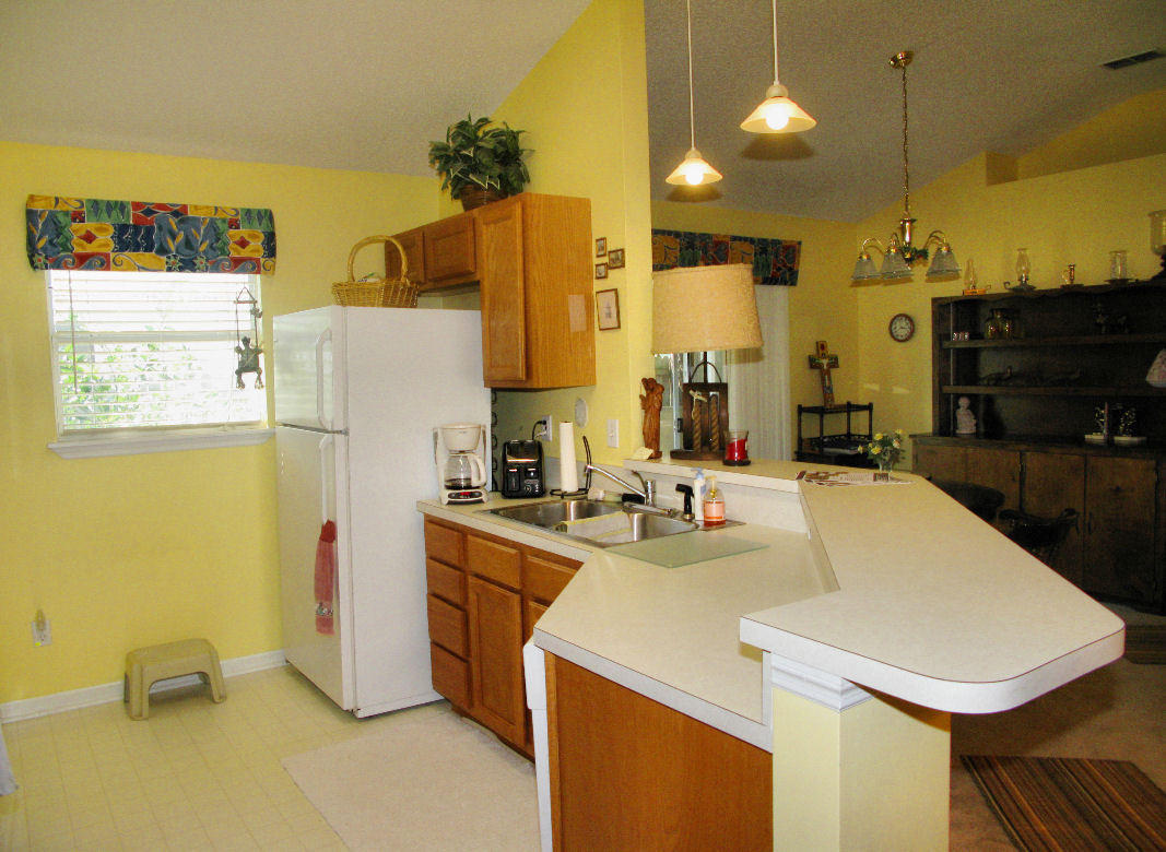 954 Stocks Street Atlantic Beach, FL 32233 - Photo 8 of 21 a kitchen that has a sink and a refrigerator