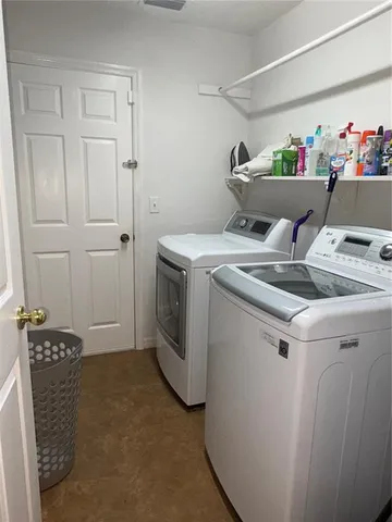 a utility room with dryer and washer