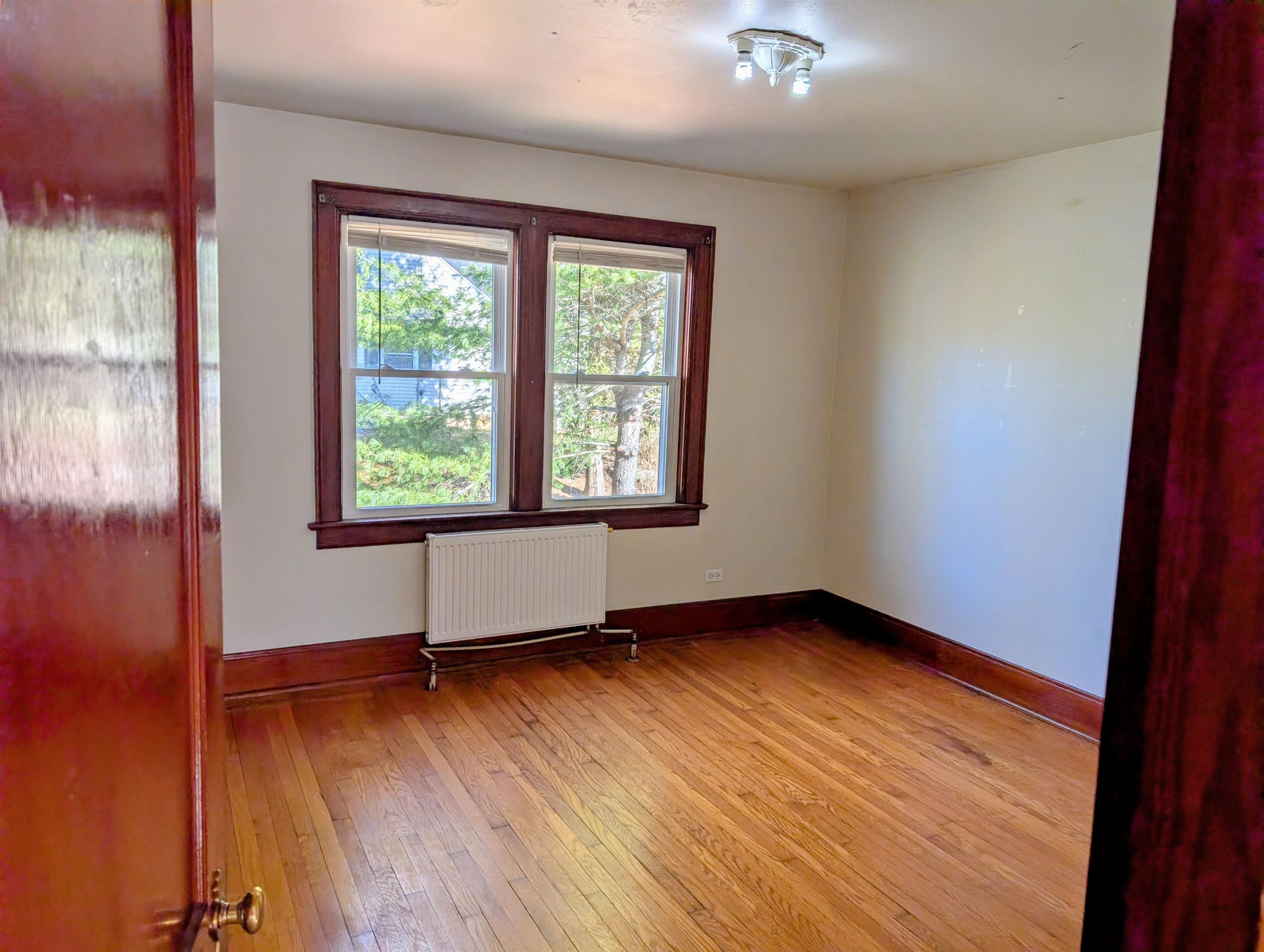 45 Methodist Lane Hot Springs, VA 24445 - Photo 11 of 17 an empty room with wooden floor and windows