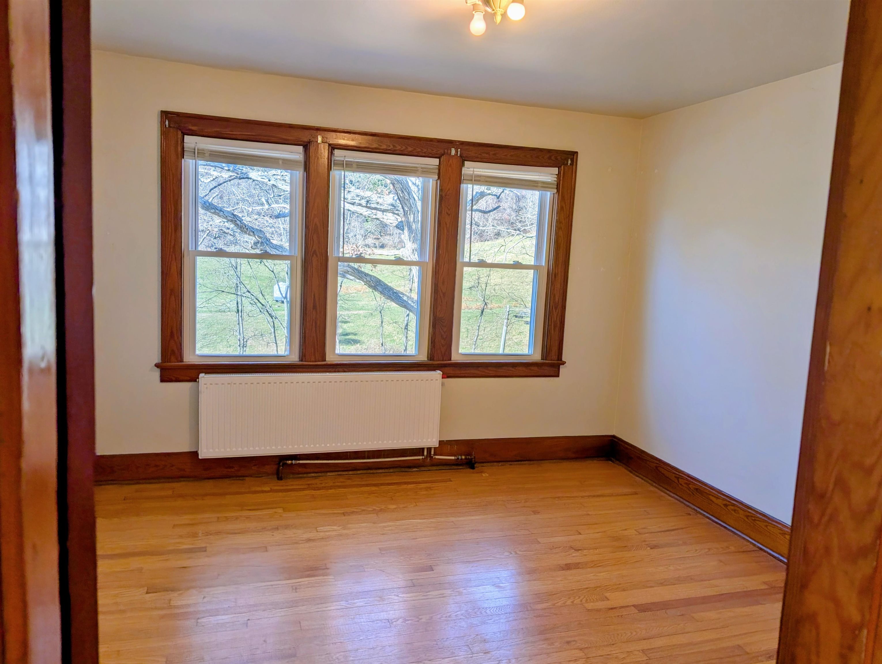 45 Methodist Lane Hot Springs, VA 24445 - Photo 13 of 17 a view of an empty room with wooden floor and a window