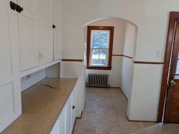 a view of a room that has a bed in it