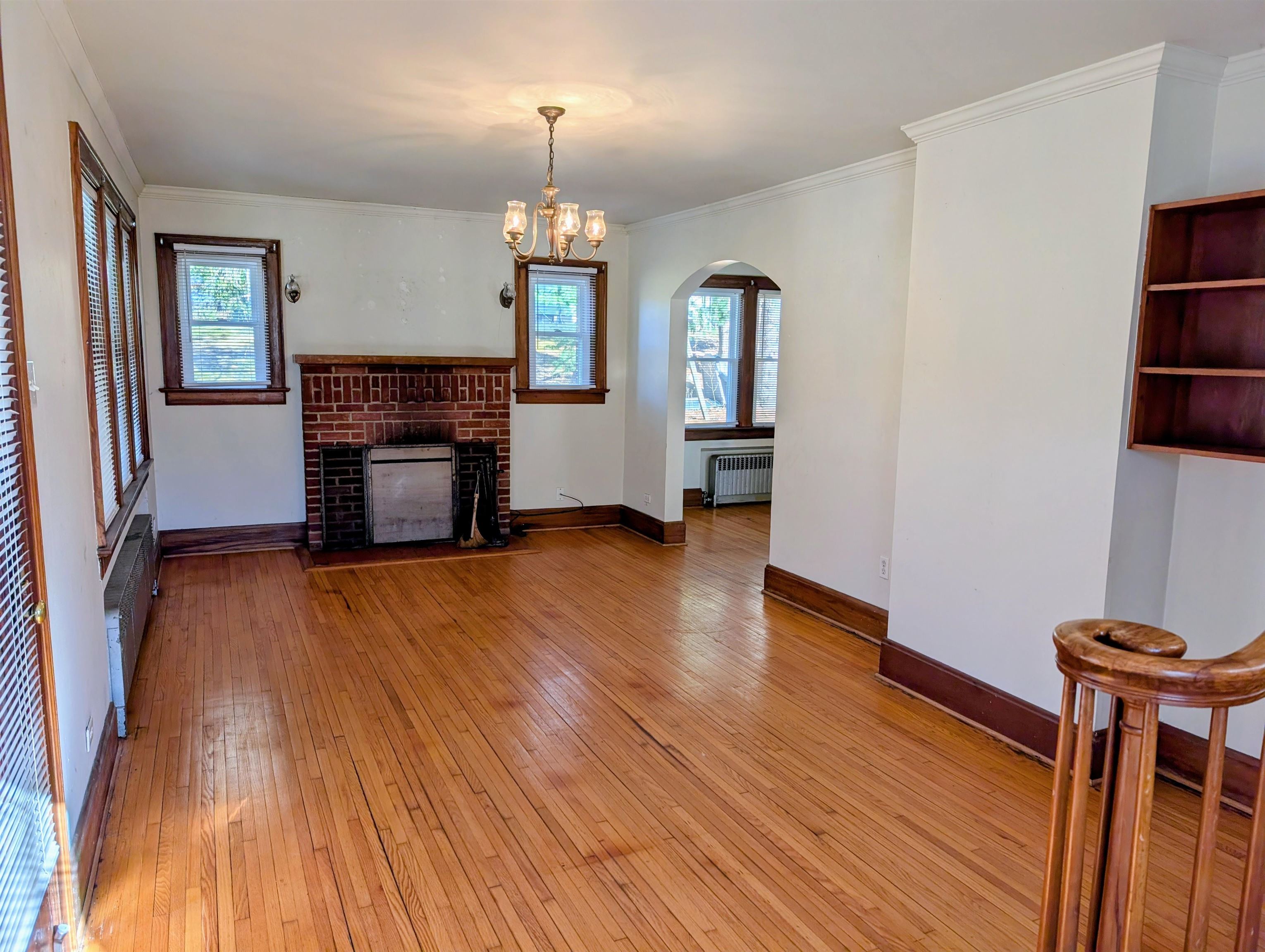 45 Methodist Lane Hot Springs, VA 24445 - Photo 5 of 17 a view of empty room with a fireplace and wooden floor
