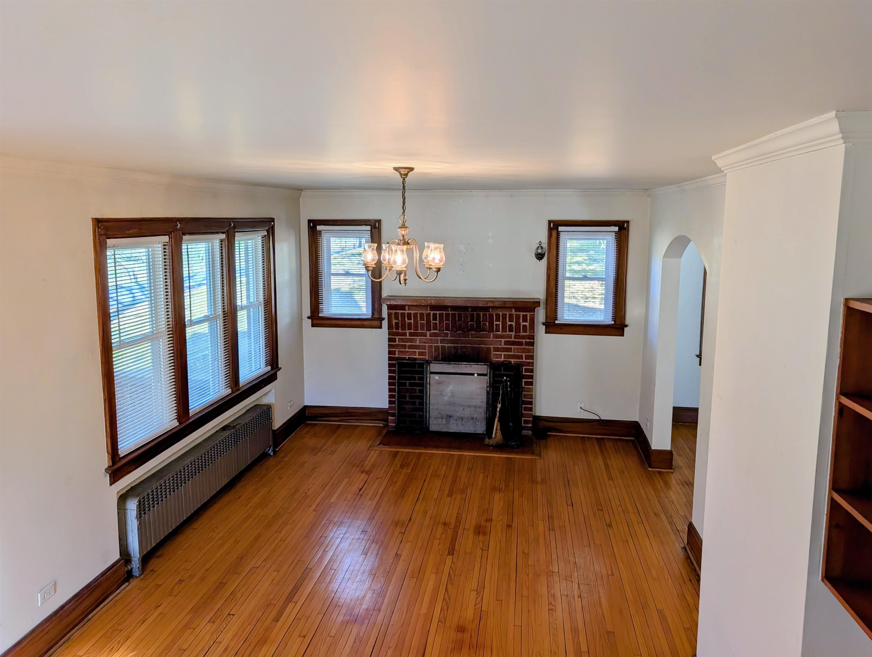 45 Methodist Lane Hot Springs, VA 24445 - Photo 6 of 17 a view of a livingroom with wooden floor and a fireplace