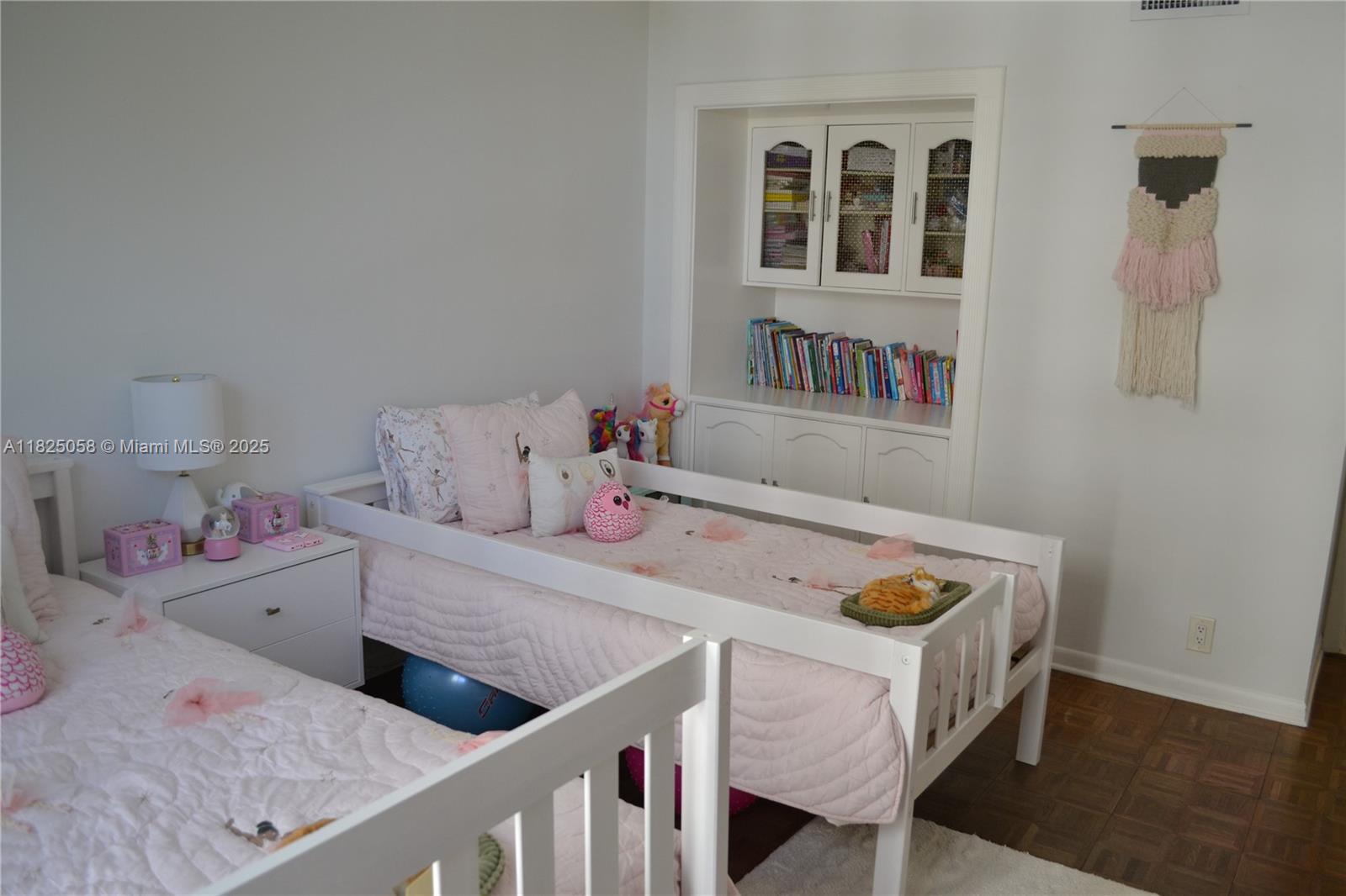 1111 Crandon Boulevard, Unit C402 Key Biscayne, FL 33149 - Photo 12 of 32 a bedroom with a bed and dresser