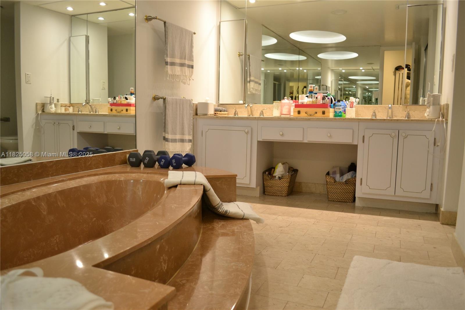 1111 Crandon Boulevard, Unit C402 Key Biscayne, FL 33149 - Photo 16 of 32 a large white tub sitting in a room