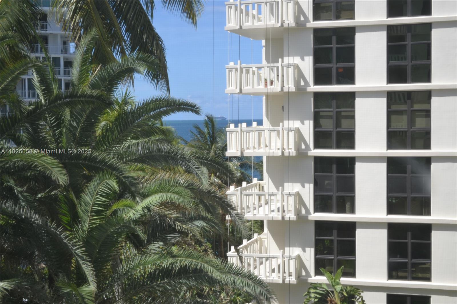 1111 Crandon Boulevard, Unit C402 Key Biscayne, FL 33149 - Photo 19 of 32 a front view of a building with balcony
