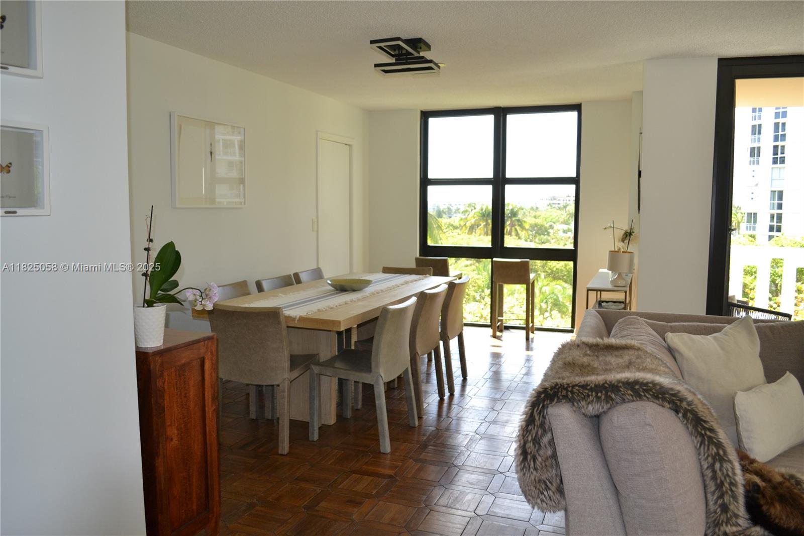 1111 Crandon Boulevard, Unit C402 Key Biscayne, FL 33149 - Photo 2 of 32 a view of a dining room with furniture and window