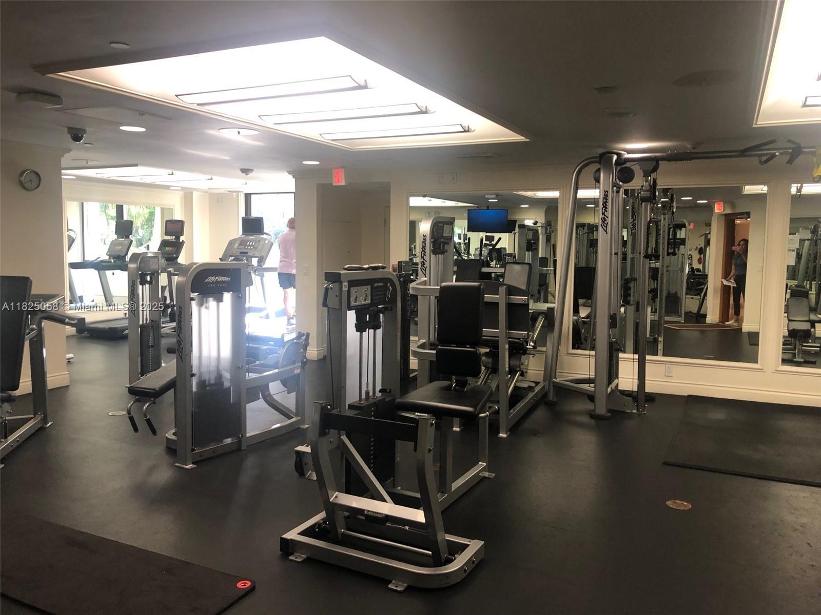 1111 Crandon Boulevard, Unit C402 Key Biscayne, FL 33149 - Photo 21 of 32 a room with gym equipment and a view of gym equipment