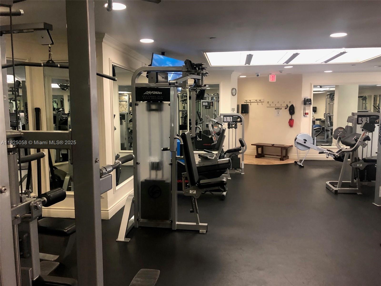1111 Crandon Boulevard, Unit C402 Key Biscayne, FL 33149 - Photo 22 of 32 a view of a room with gym equipment