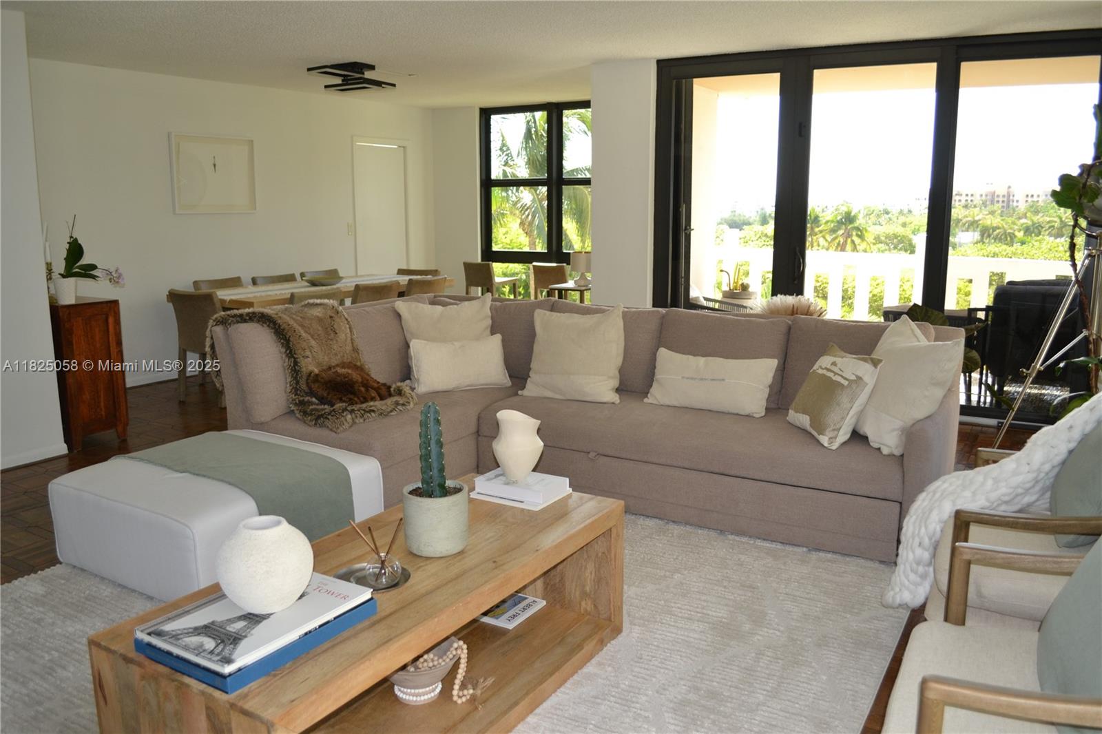 1111 Crandon Boulevard, Unit C402 Key Biscayne, FL 33149 - Photo 4 of 32 a living room with furniture and a window