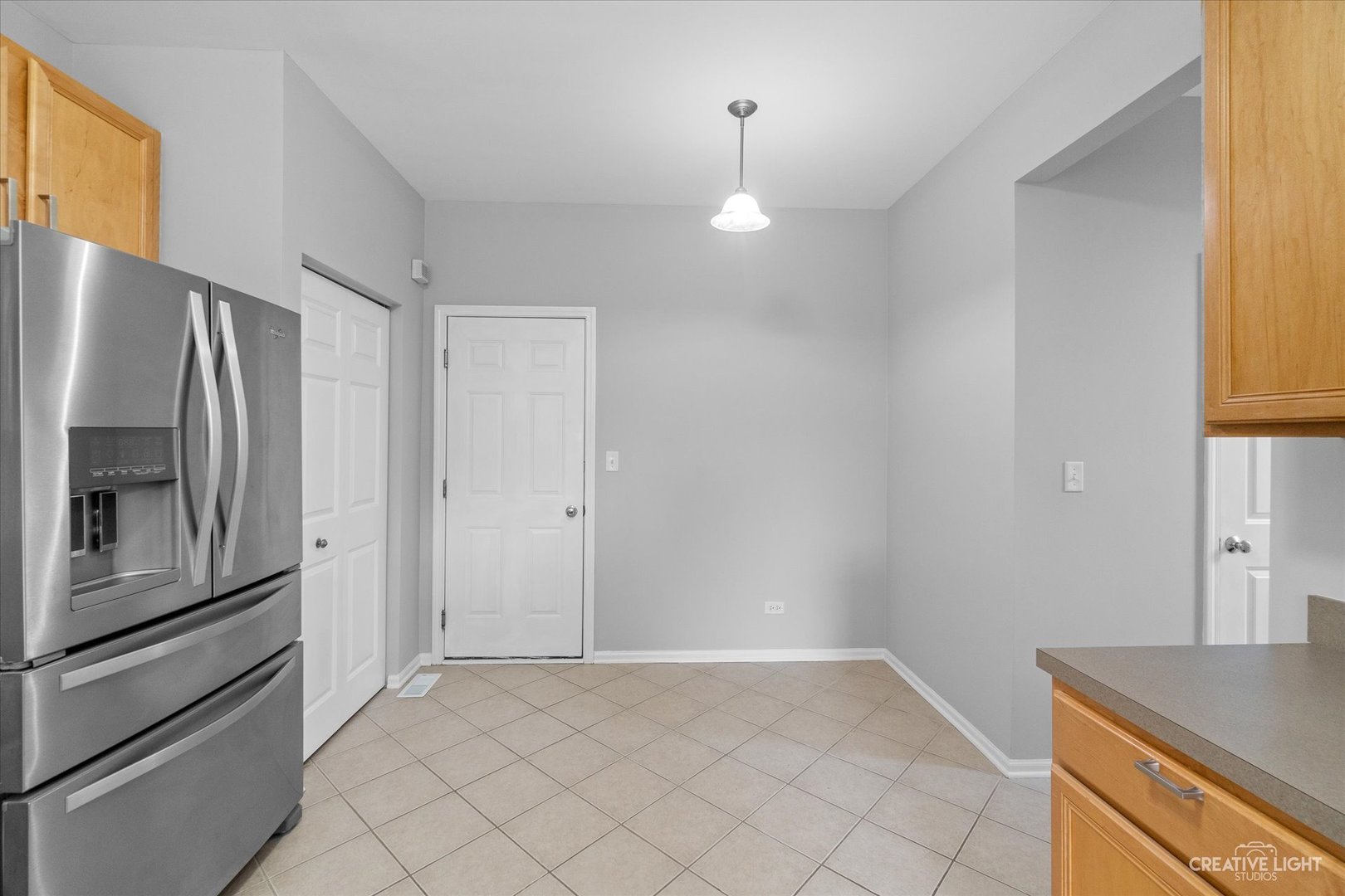 19 Lily Court Bolingbrook, IL 60440 - Photo 11 of 31 a view of a kitchen with a sink refrigerator and cabinets