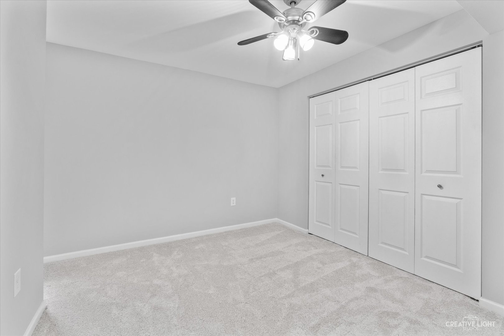 19 Lily Court Bolingbrook, IL 60440 - Photo 21 of 31 an empty room with a chandelier fan