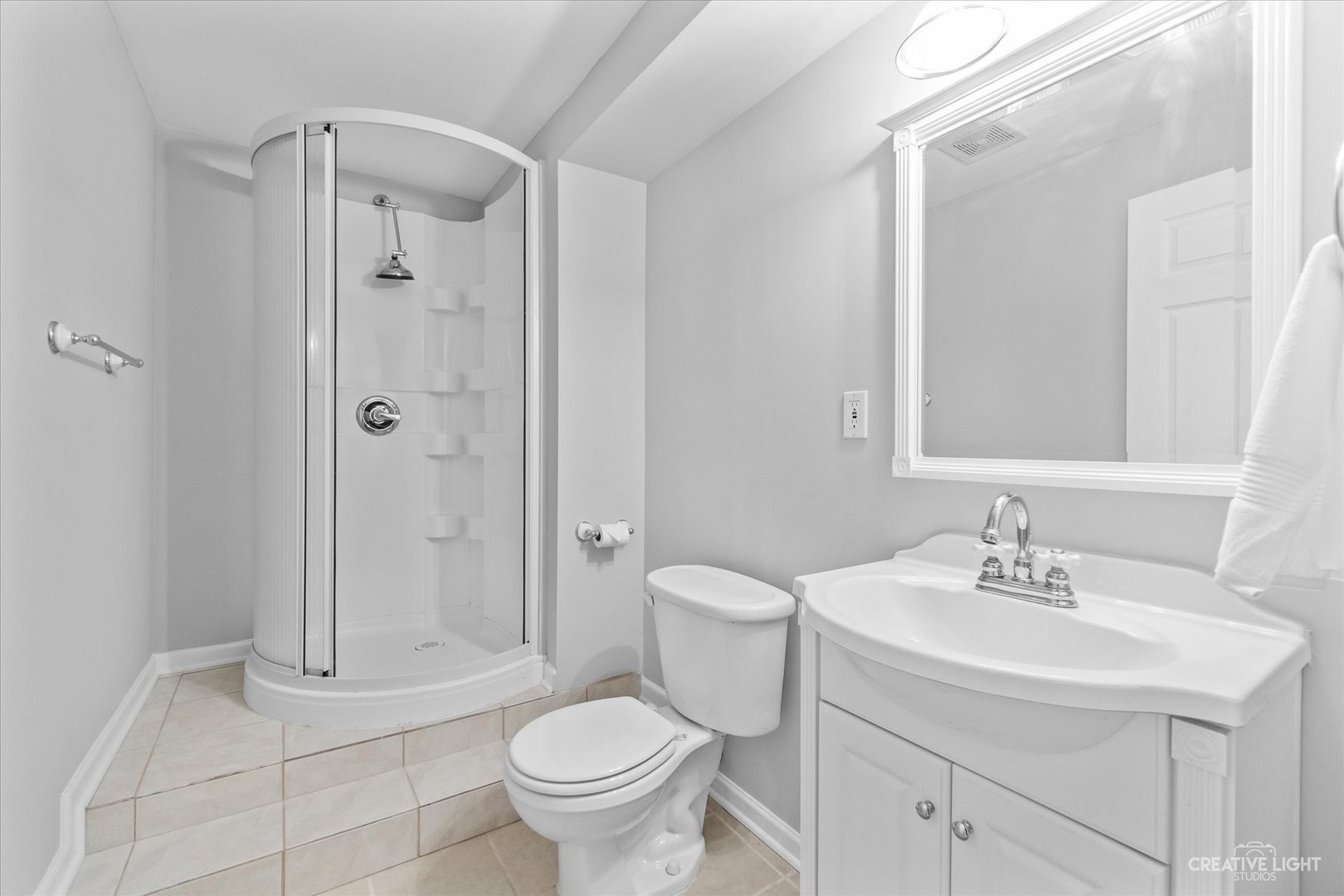 19 Lily Court Bolingbrook, IL 60440 - Photo 22 of 31 a bathroom with a sink toilet and shower