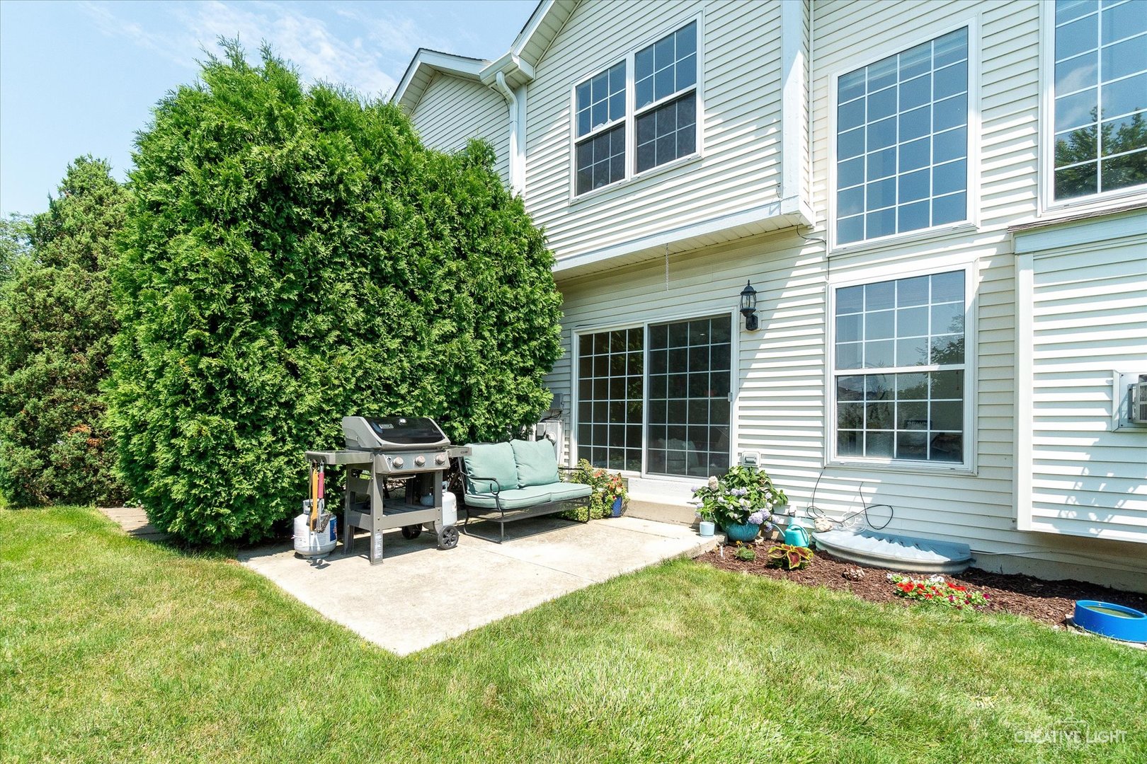 19 Lily Court Bolingbrook, IL 60440 - Photo 23 of 31 a backyard of a house with table and chairs and potted plants