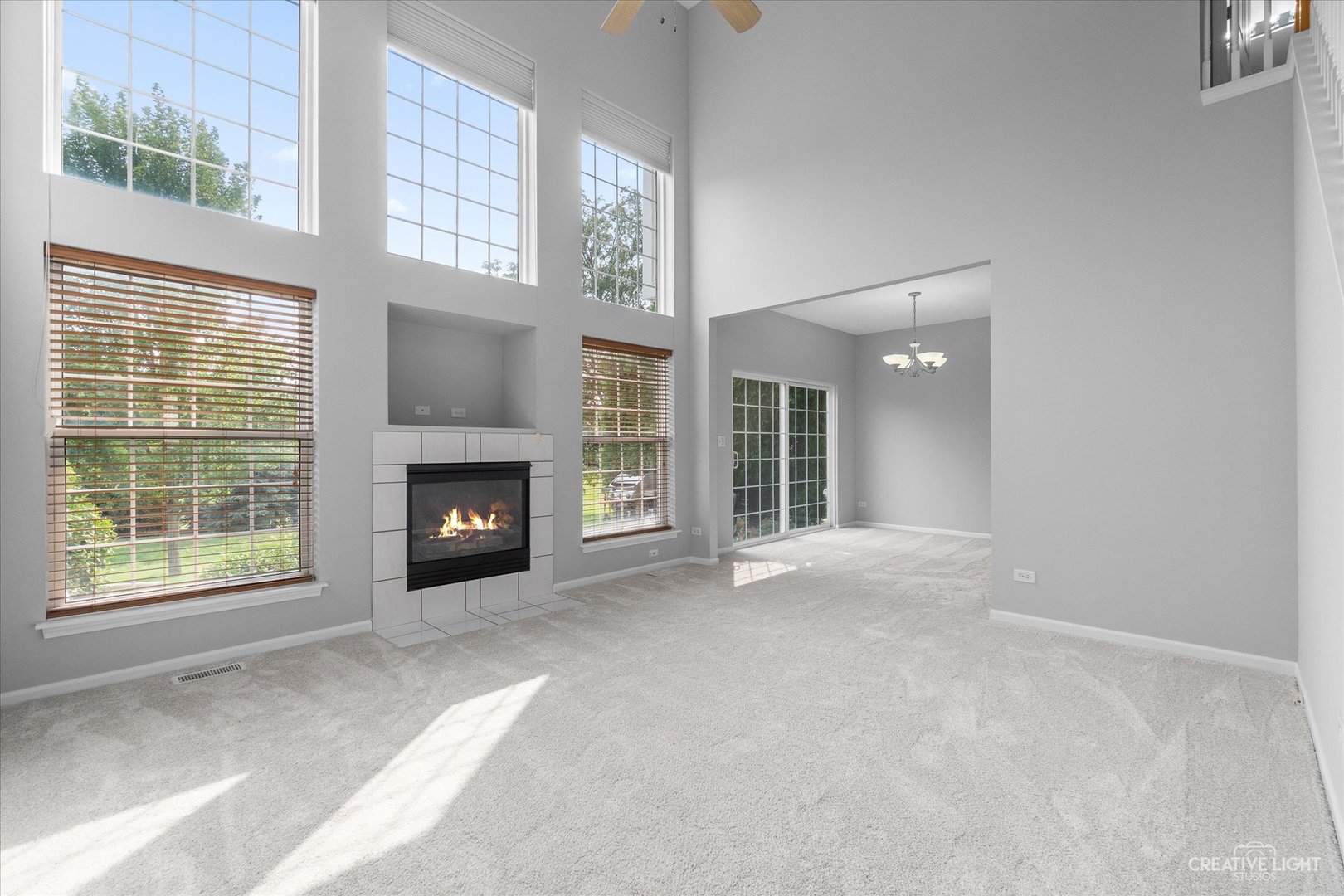 19 Lily Court Bolingbrook, IL 60440 - Photo 4 of 31 an empty room with windows and fireplace