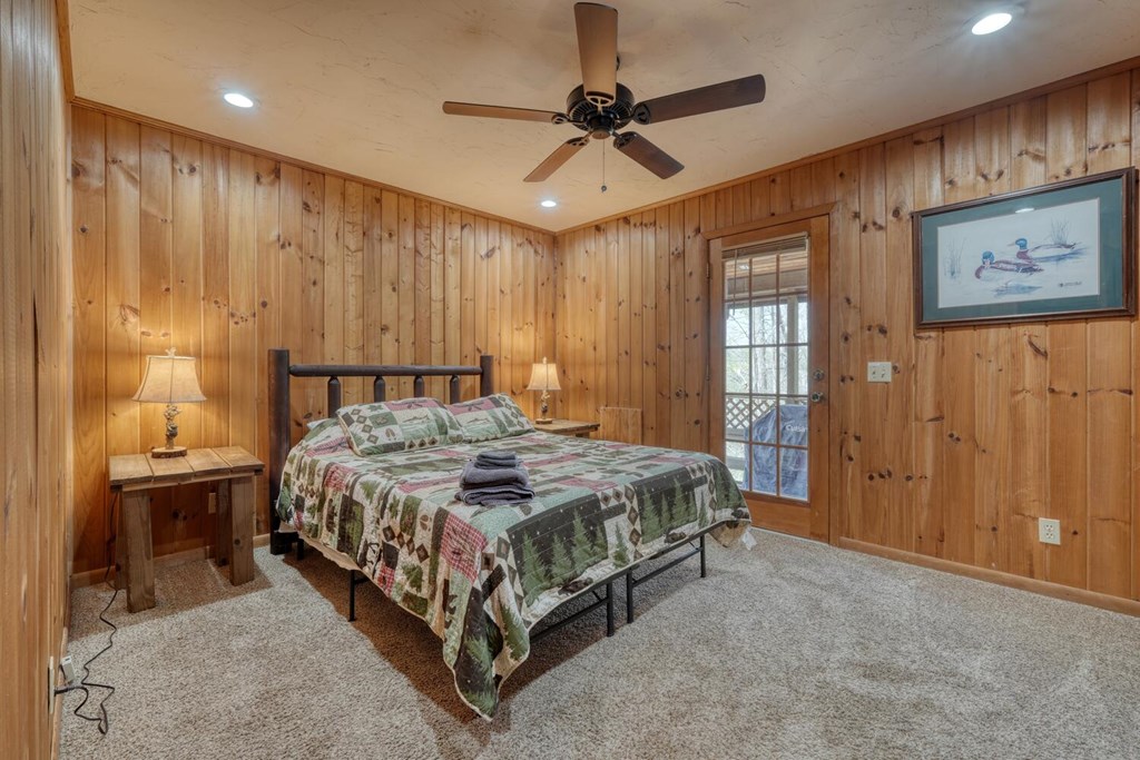264 Tanglewood Drive Blue Ridge, GA 30513 - Photo 20 of 47 a spacious bedroom with a bed and a table