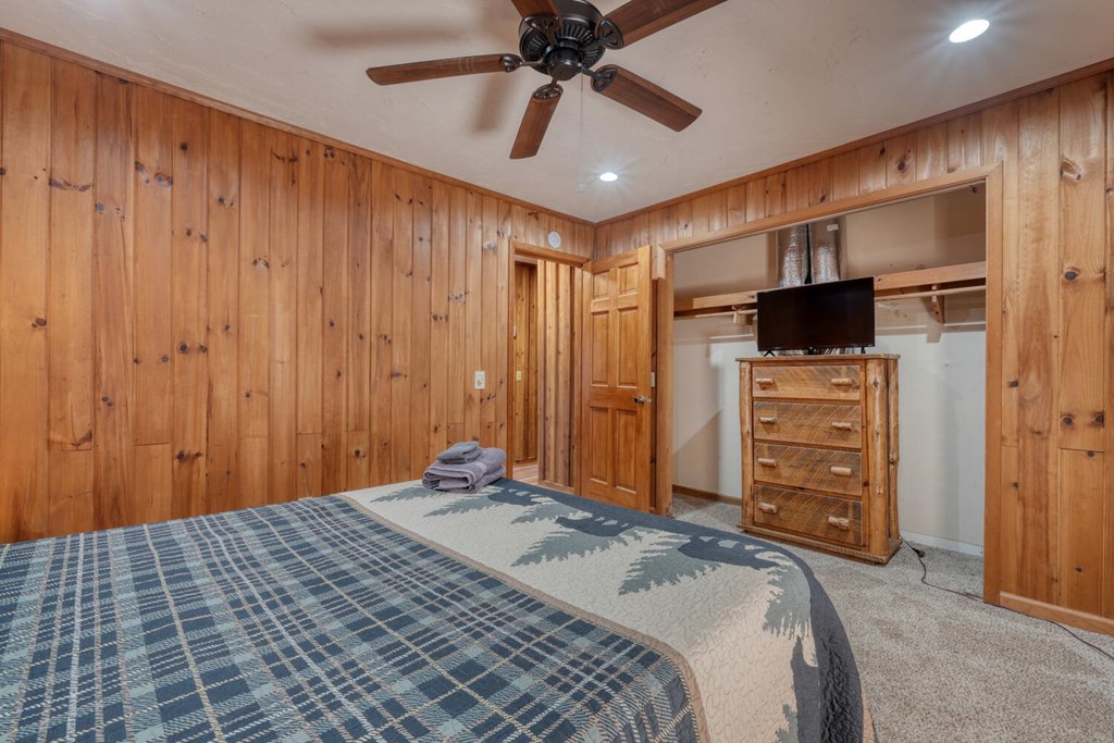 264 Tanglewood Drive Blue Ridge, GA 30513 - Photo 23 of 47 a bedroom with a bed and a walk in closet