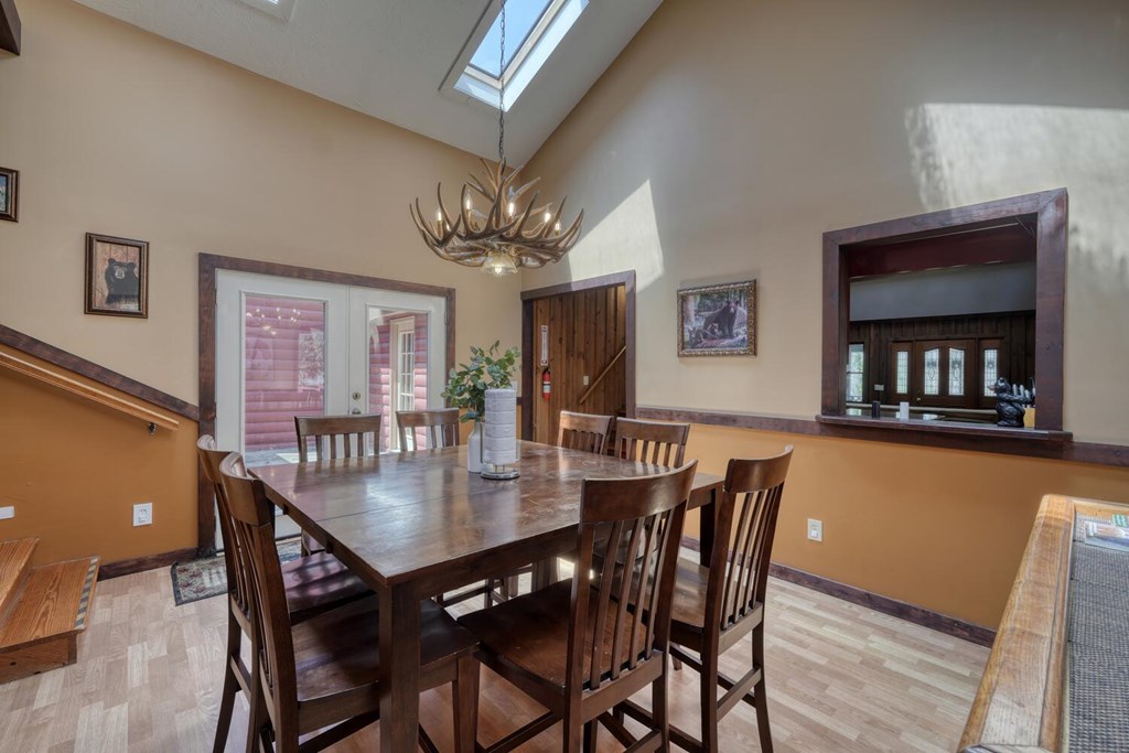 264 Tanglewood Drive Blue Ridge, GA 30513 - Photo 25 of 47 a view of a dining room with furniture and chandelier