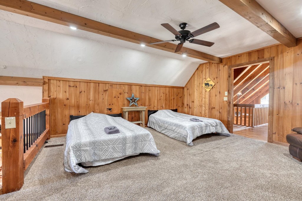 264 Tanglewood Drive Blue Ridge, GA 30513 - Photo 41 of 47 a spacious bedroom with a bed and ceiling fan