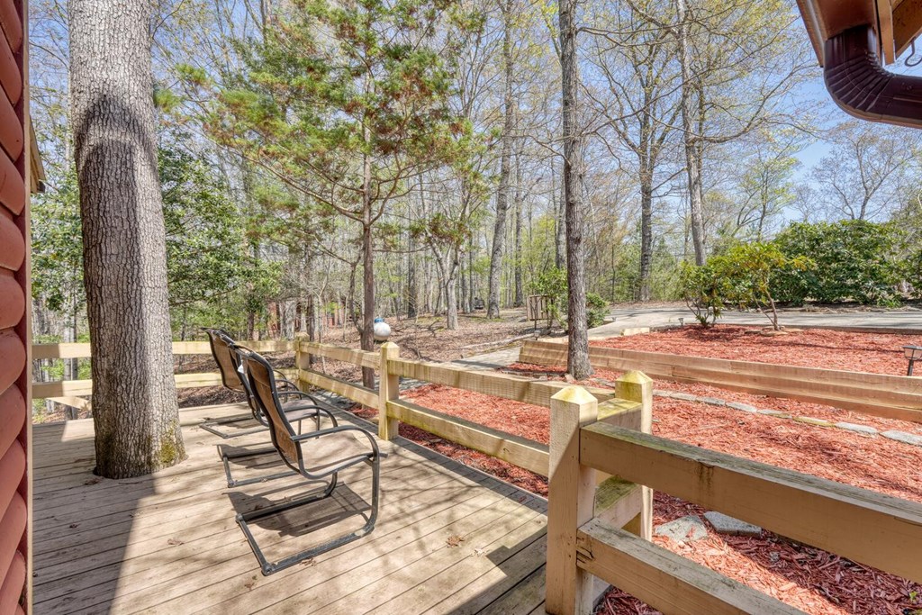 264 Tanglewood Drive Blue Ridge, GA 30513 - Photo 6 of 47 a view of a patio with chairs and a table and chairs