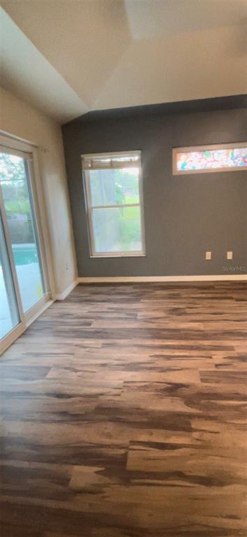 22631 Robbins Road Astatula, FL 34705 - Photo 17 of 35 a view of an empty room with a window