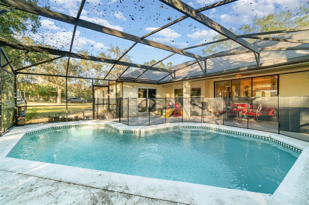 22631 Robbins Road Astatula, FL 34705 - Photo 21 of 35 a view of a swimming pool