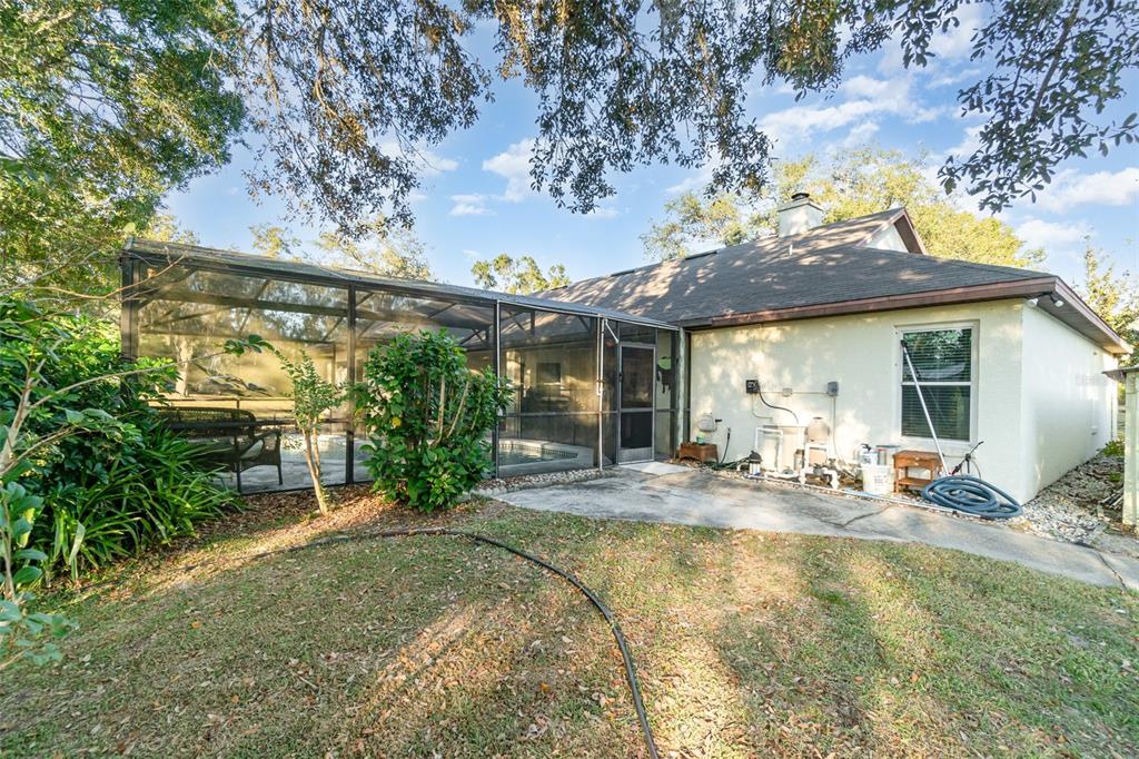 22631 Robbins Road Astatula, FL 34705 - Photo 23 of 35 a view of a house with backyard and sitting area