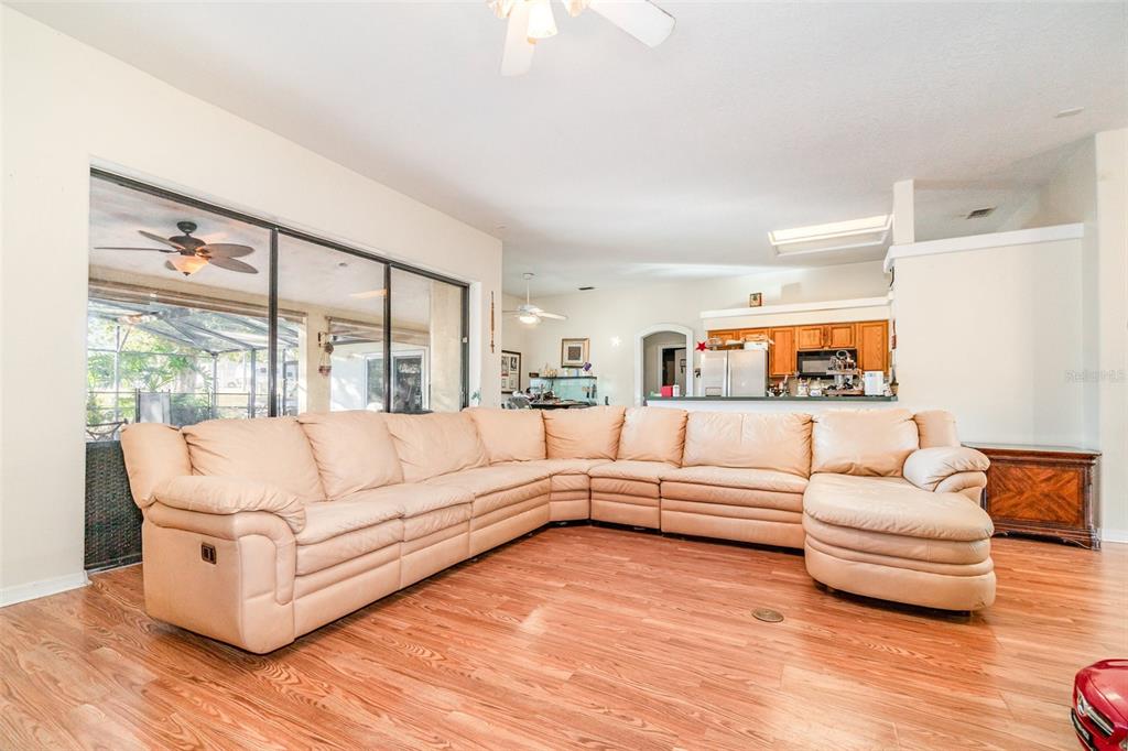 22631 Robbins Road Astatula, FL 34705 - Photo 8 of 35 a living room with furniture and a large window
