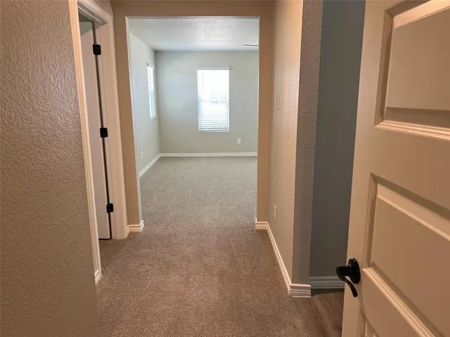 wooden floor and window in a en suite bathroom