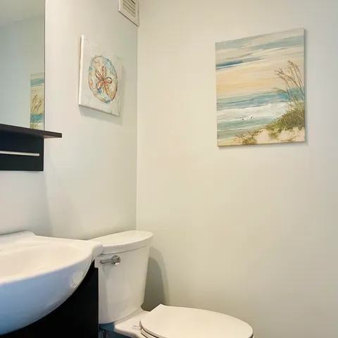 a living room with stainless steel appliances kitchen island granite countertop furniture and a kitchen view