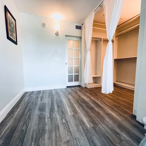 a bed room with a bed and a window