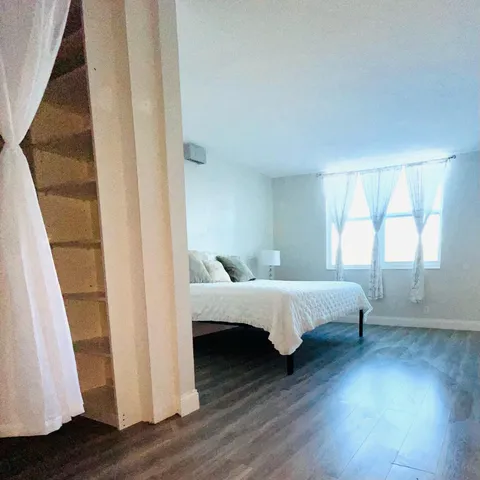 a bathroom with a sink toilet a mirror and shower