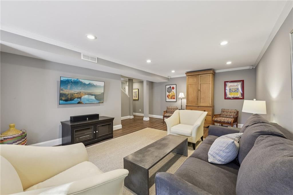 101 Dartmouth Avenue Avondale Estates, GA 30002 - Photo 35 of 53 a living room with furniture and a flat screen tv