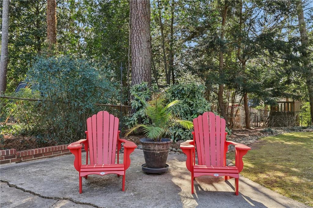 101 Dartmouth Avenue Avondale Estates, GA 30002 - Photo 37 of 53 a table and chairs sitting in the middle of a yard