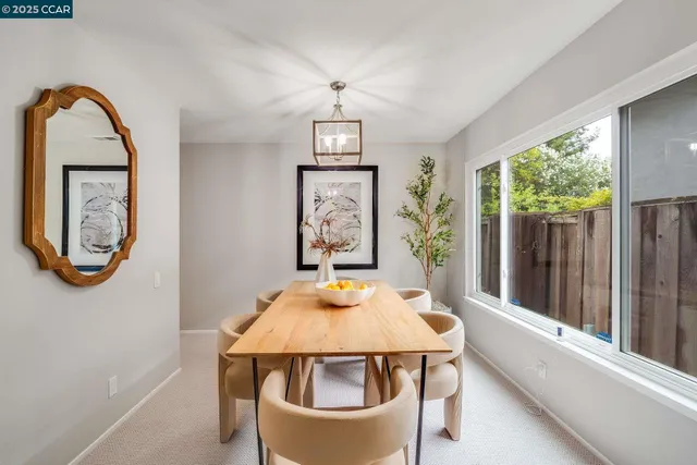 a view of a dining room with furniture window and outside view