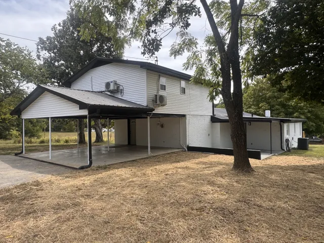 a view of outdoor space with deck and trees