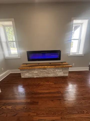 a view of an empty room and a window