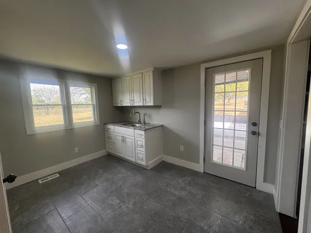 a bathroom with a glass door shower
