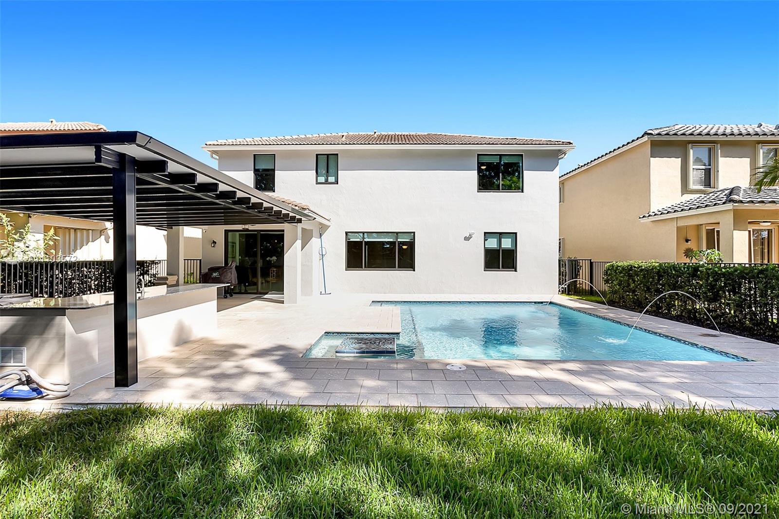 19124 Seneca Avenue Weston, FL 33332 - Photo 19 of 38 a view of outdoor space yard and porch