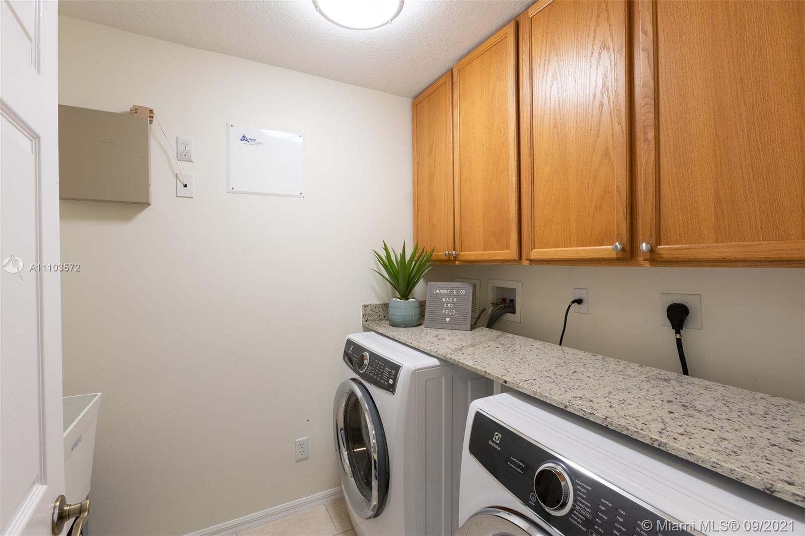 19124 Seneca Avenue Weston, FL 33332 - Photo 21 of 38 a utility room with dryer and washer