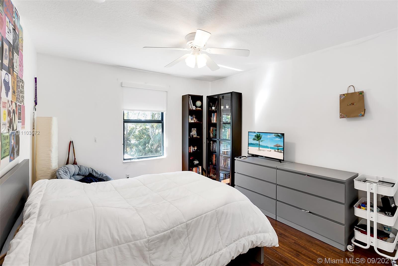 19124 Seneca Avenue Weston, FL 33332 - Photo 23 of 38 a bedroom with a bed and a window