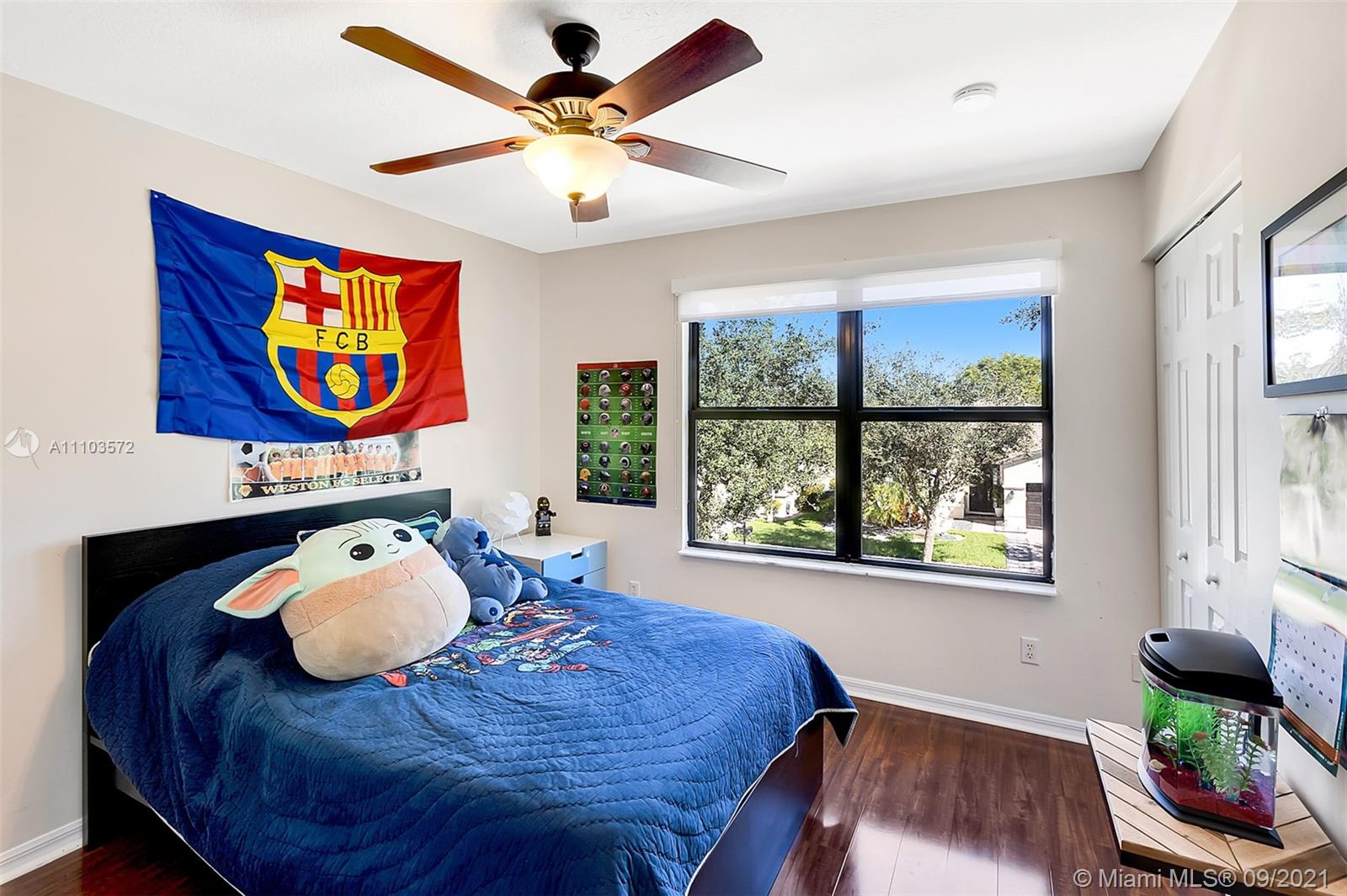 19124 Seneca Avenue Weston, FL 33332 - Photo 27 of 38 a bedroom with furniture and a bed