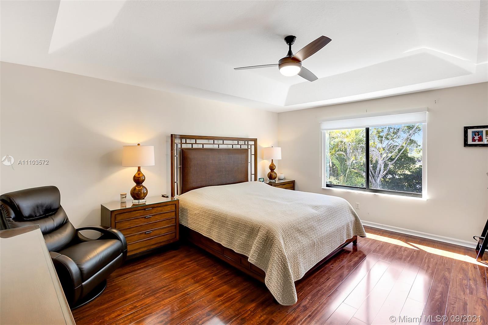 19124 Seneca Avenue Weston, FL 33332 - Photo 30 of 38 a bedroom with a bed and a couch