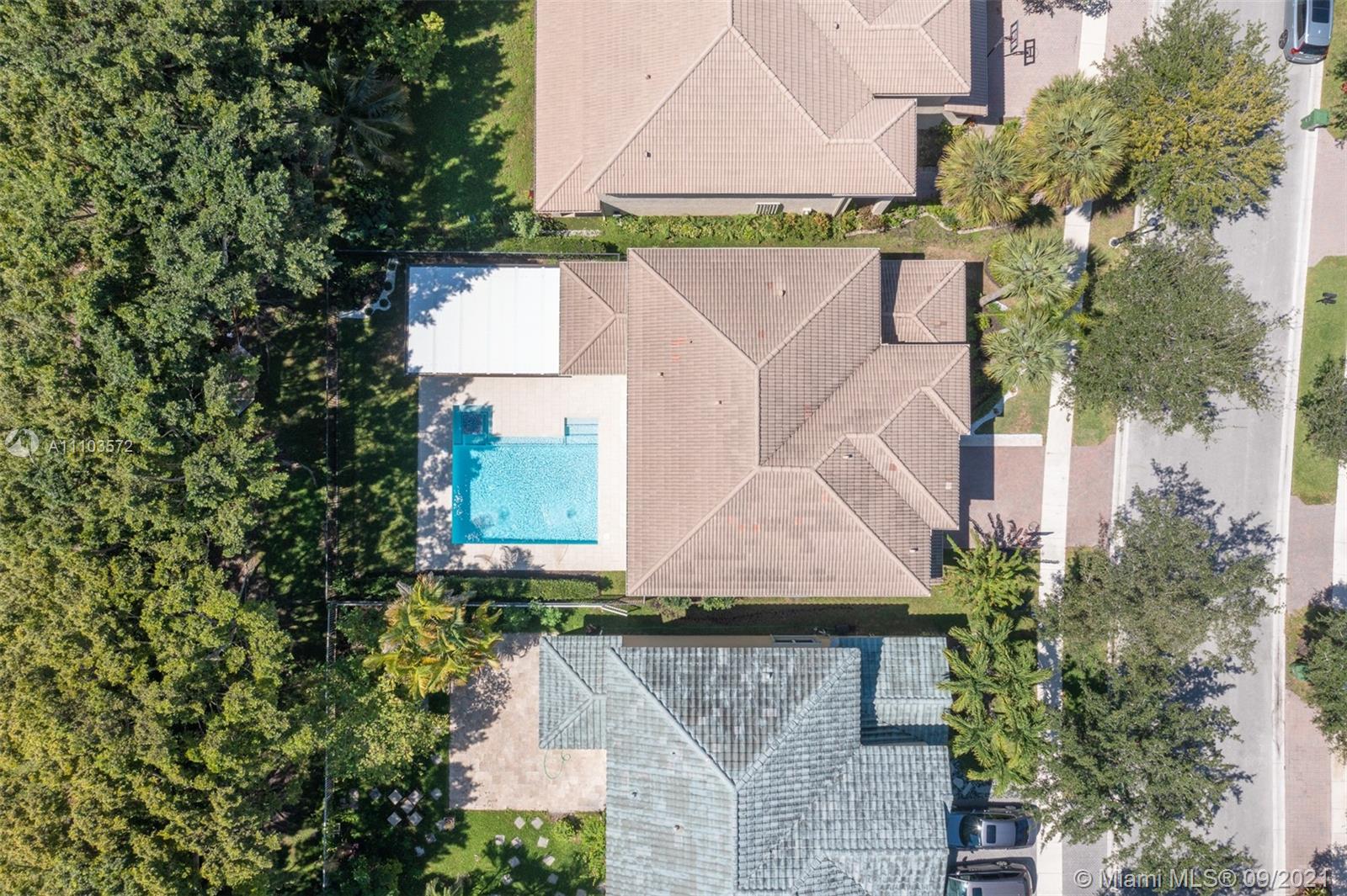 19124 Seneca Avenue Weston, FL 33332 - Photo 33 of 38 an aerial view of a house with a yard and a car park